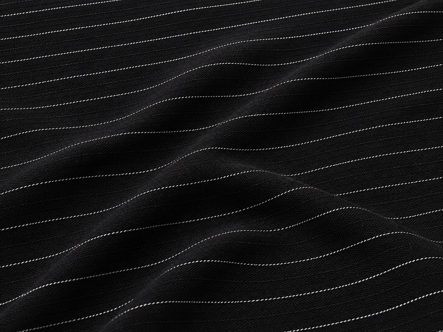Black Pinstripe Herringbone Suiting Fabric On the bench